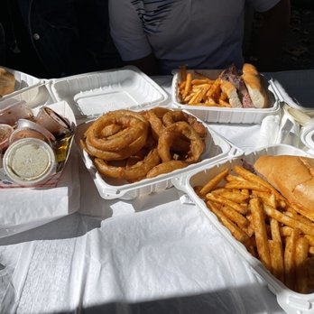 Cold Spring Tavern - Original Cold Spring Tri Tip Sandwich with French fries, onion rings, and the sauces - American Near Me - Santa Barbara, California