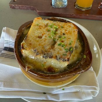 Showroom - braised pork and french onion soup with a piece of bread and cheese on top - New American Near Me - Frederick, Maryland