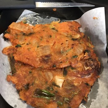 Bopbox - Kimchi pancake. Sorry, we were hungry and already cut off a piece! - Asian Fusion Near Me - Seattle, Washington