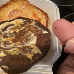 Burger St - Fly that walked out of my veggie burger, smushed by my partners thumb.