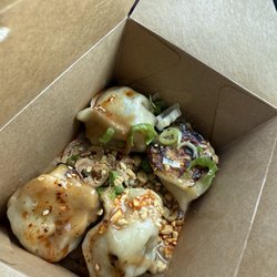 Delmar Farmers Market - We got it to go so this what it looks like in the box. Chicken and Thai basil dumplings.