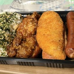 Fatboys - Fatboy bento- fried fish, hot dog, Teri beef, 2 garlic chicken thighs, slice spam, and 2 scoops rice.