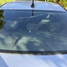 The rear windshield before repair.