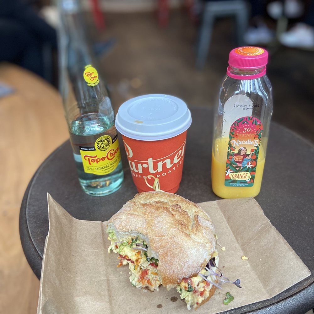 Partners Coffee - Brooklyn - Half eaten sun dried tomato egg sandwich. It smelled so good I dug right in and forgot to take a pic first! - Coffee & Tea Near Me - Brooklyn, New York