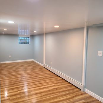 Michael's Interior Services - empty room with hard wood floors - Drywall Installation & Repair Near Me