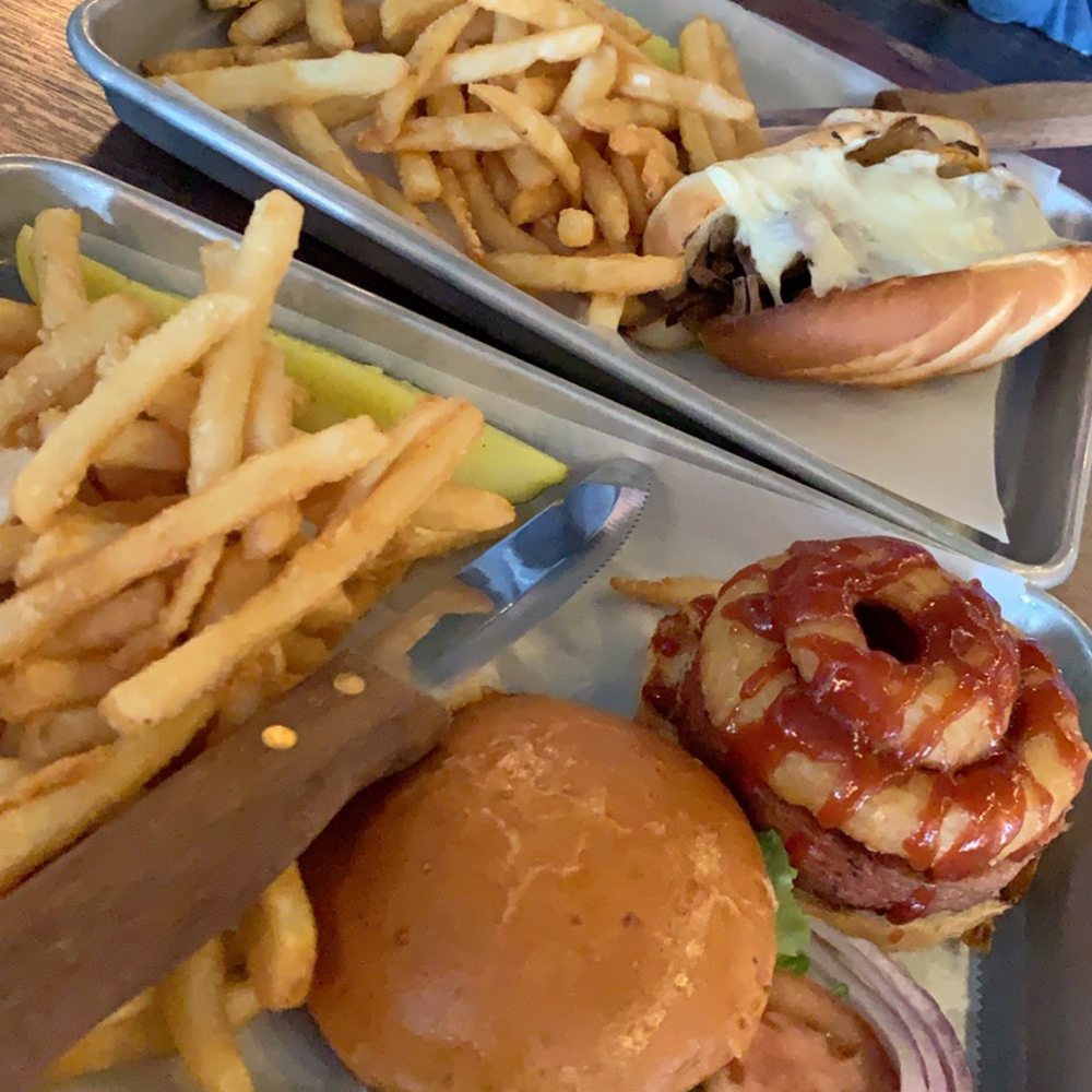 Rodeo burger and Philly cheesesteak with fries Rodeo burger and Philly cheesesteak with fries