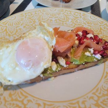 CalaMillor - Avocado toast, love the addition of the pomegranate seeds. - Spanish Near Me - Miami, Florida