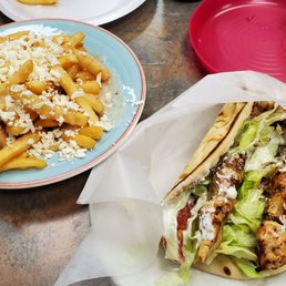 Greek fries and Chicken Souvlaki Pita (2 skewers). Greek fries and Chicken Souvlaki Pita (2 skewers).
