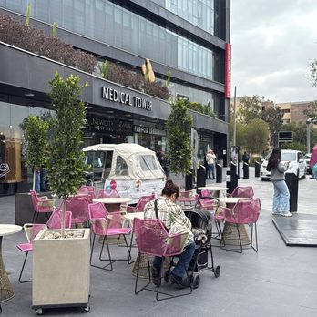 New Age Dental Clinic - The entrance of the building has Jose Cafe, Open table restaurant and great selection of restaurants in the food court at Plaza floor - Oral Surgeons Near Me - Tijuana, BCN