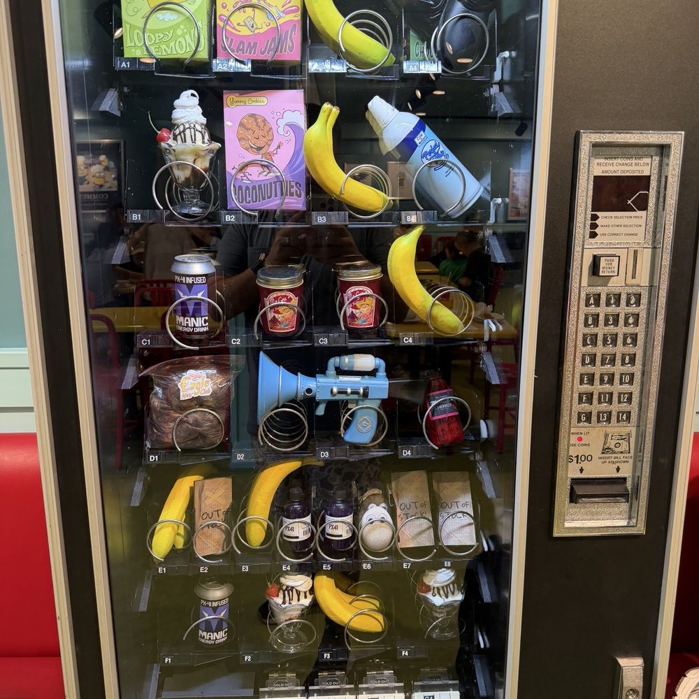 Illumination’s Minion Cafe - Silly minion vending machine with all the quirky gadgets like in the movie. - New American Near Me - Orlando, Florida Illumination’s Minion Cafe - Silly minion vending machine with all the quirky gadgets like in the movie. - New American Near Me - Orlando, Florida