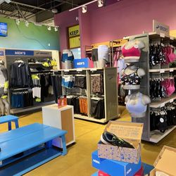 Road Runner Sports - Seating area and clothes