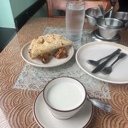 Paradise Of India Restaurant - Delicious, piping hot coconut soup and Papad with chutneys ready to go.
