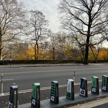 Perfect Picnic - a row of parking meters on a city street - Sandwiches Near Me - New York, New York