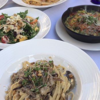 Cucina Venti Restaurant - Bottom: Fettuccine Alfredo with Duck Confit  Right corner: Pesto Tortellini Left corner: Mango Salad Far end: Penne pasta with prawns - Italian Near Me - Mountain View, California