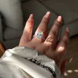 Blueberry Jewelers - Custom 5.53 Emerald Diamond ring with an emerald eternity band and a hidden halo