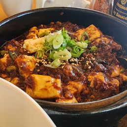 Mapo Tofu with Pork and Shiitaki mushrooms. Very spicy. Mapo Tofu with Pork and Shiitaki mushrooms. Very spicy.