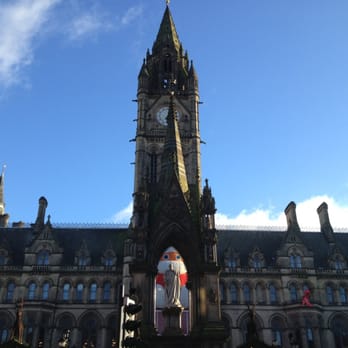 Albert Square - During the Christmas Market, you can find a cute, chubby Santa sitting in front of the Town Hall. - Local Flavor Near Me - Manchester, XGM Albert Square - During the Christmas Market, you can find a cute, chubby Santa sitting in front of the Town Hall. - Local Flavor Near Me - Manchester, XGM