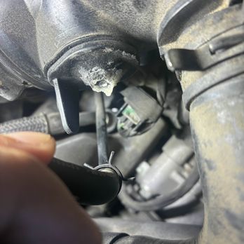 Alta Mere Auto Care - Broken JB weld that sealed my air intake shut. The hose that belongs on the nipple is left disconnected with its spring clamp still attached - Auto Repair Near Me - Fort Worth, Texas Alta Mere Auto Care - Broken JB weld that sealed my air intake shut. The hose that belongs on the nipple is left disconnected with its spring clamp still attached - Auto Repair Near Me - Fort Worth, Texas