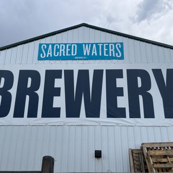 Sacred Waters Brewing Company - a sign for sacred waters brewery - Breweries Near Me - Kalispell, Montana