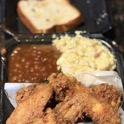 TrucKings BBQ - 4 piece Fried Wing Dinner with potato salad and baked beans.
