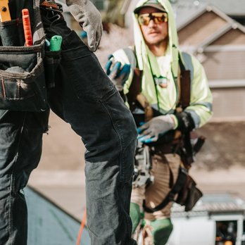 Moss Boss Roofing - Roofing professionals reviewing materials and installation details during a residential roofing project. - Roofing Near Me Moss Boss Roofing - Roofing professionals reviewing materials and installation details during a residential roofing project. - Roofing Near Me