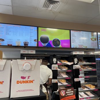 Dunkin' -  a man working in a donut shop - Coffee & Tea Near Me - Ellenton, Florida