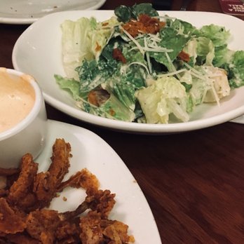 Outback Steakhouse - Caesar salad. Got creative and added some of the onion petals to the salad for some salty crunch! - Steakhouses Near Me - Orlando, Florida Outback Steakhouse - Caesar salad. Got creative and added some of the onion petals to the salad for some salty crunch! - Steakhouses Near Me - Orlando, Florida