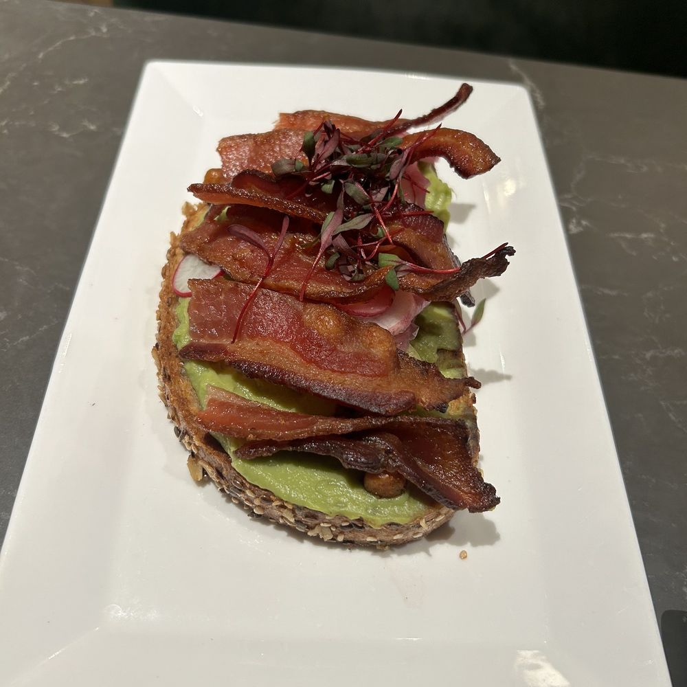 Serrano Vista Cafe - Avocado toast breakfast at the Vista Cafe-has bacon added to it-makes it so much better - Cafes Near Me - S Highland, California Serrano Vista Cafe - Avocado toast breakfast at the Vista Cafe-has bacon added to it-makes it so much better - Cafes Near Me - S Highland, California