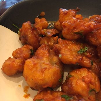 Masala Kraft Cafe - Mixing It W/ Sauce~~~'Lasooni Gobi': Crispy Cauliflower Tossed W/ Garlic, Tomato & Cilantro - Indian Near Me - Hartsdale, New York