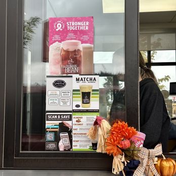 The Human Bean - a woman sitting on a window sill - Coffee & Tea Near Me - Springfield, Oregon