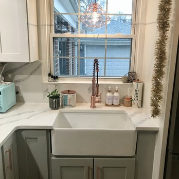 CMK Remodeling - a kitchen with a sink and a window - General Contractors Near Me