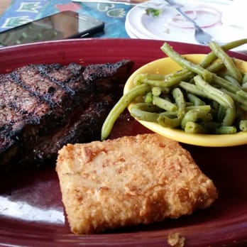Graham's Landing - Ribeye, green beans and grit cake. Very good. - Seafood Near Me - Murrells Inlet, South Carolina Graham's Landing - Ribeye, green beans and grit cake. Very good. - Seafood Near Me - Murrells Inlet, South Carolina