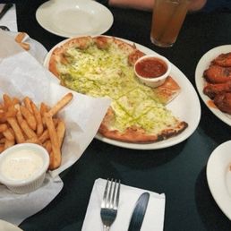 Pesto bites, garlic fries, regular fries, buffalo wings