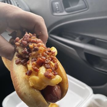 Meltdown Grill - a hand holding a hot dog - Burgers Near Me - Hartford, Connecticut Meltdown Grill - a hand holding a hot dog - Burgers Near Me - Hartford, Connecticut