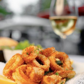 Fratellino - Crispy calamari + chilled white wine, summer perfection by the bite! - Italian Near Me - Coral Gables, Florida Fratellino - Crispy calamari + chilled white wine, summer perfection by the bite! - Italian Near Me - Coral Gables, Florida