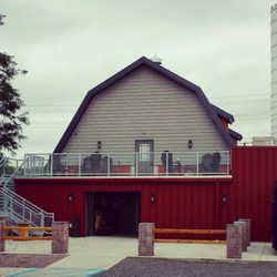 Tailspin Brewing Company - Outside back, showing upstairs and downstairs options. Taken from the gravel parking lot.