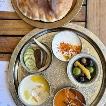 Dalida - Breaking Bread: Hummus, muhammara, smoked yogurt, pickles, marinated olives, chubby pita ($18) - Mediterranean Near Me - San Francisco, California Dalida - Breaking Bread: Hummus, muhammara, smoked yogurt, pickles, marinated olives, chubby pita ($18) - Mediterranean Near Me - San Francisco, California