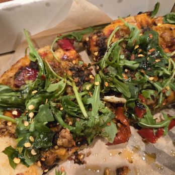 Oakshire Commons - Vegan sausage and pepperoni pizza with vegan cheese, vegan pepperoni and a tempeh "sausage" topped with basalmic and arugula. - Kombucha Near Me - Springfield, Oregon