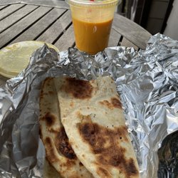 Ganesh Indian Cuisine - Garlic naan and mango lasi