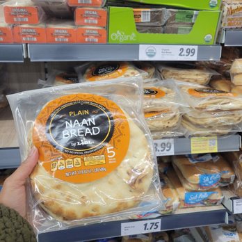 Lidl - a person holding a bag of naan bread - Grocery Near Me - Folsom, Pennsylvania