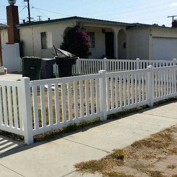 Mr Builder Vinyl Fence - a white picketer in front of a house - General Contractors Near Me Mr Builder Vinyl Fence - a white picketer in front of a house - General Contractors Near Me