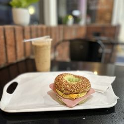 5 Star Bagelry - Iced vietnamese coffee & Spinach Bagel Ham, Egg & cheese.