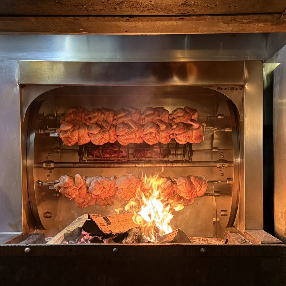 Redstone American Grill - Rotsserie chicken being grilled right next to our table - Steakhouses Near Me - Marlton, New Jersey Redstone American Grill - Rotsserie chicken being grilled right next to our table - Steakhouses Near Me - Marlton, New Jersey