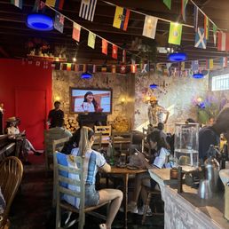 Betty La Fea on the TV for FIFA commercial. Inside of restaurant.