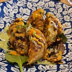 Kume - Dinosaur egg appetizer (deep fried stuffed avocado with spicy tuna, and imitation crab) topped with fish roe - $12