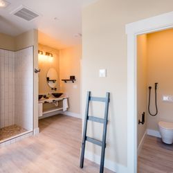 The Barn B&B Walla Walla - A view of the bathroom of a typical suite. The bathroom looks out into a private garden with a second, outdoor hot water shower!