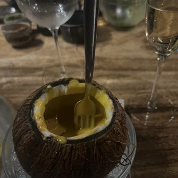 RosaNegra Cancun - Salmon ceviche served cold in a coconut covered in a sweet and spicy mango sauce - Steakhouses Near Me - Cancún, ROO RosaNegra Cancun - Salmon ceviche served cold in a coconut covered in a sweet and spicy mango sauce - Steakhouses Near Me - Cancún, ROO