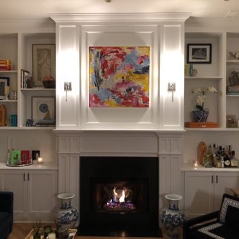 Ecopro Painting - Mike designed and custom built this mantle and above with sconces and the built in cabinets and bookcases on the sides. - Painters Near Me - Downers Grove, Illinois Ecopro Painting - Mike designed and custom built this mantle and above with sconces and the built in cabinets and bookcases on the sides. - Painters Near Me - Downers Grove, Illinois