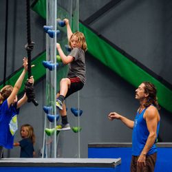 Synergy Climbing And Ninja - Floating climbing wall obstacle in ninja zone.