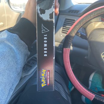 Walmart Supercenter - a person holding a nintendo wii controller in a car - Grocery Near Me - Kyle, Texas